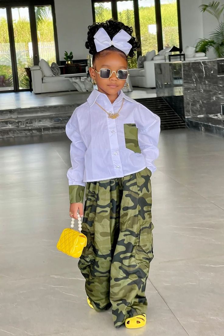 A girl wearing a stylish kid's outfit